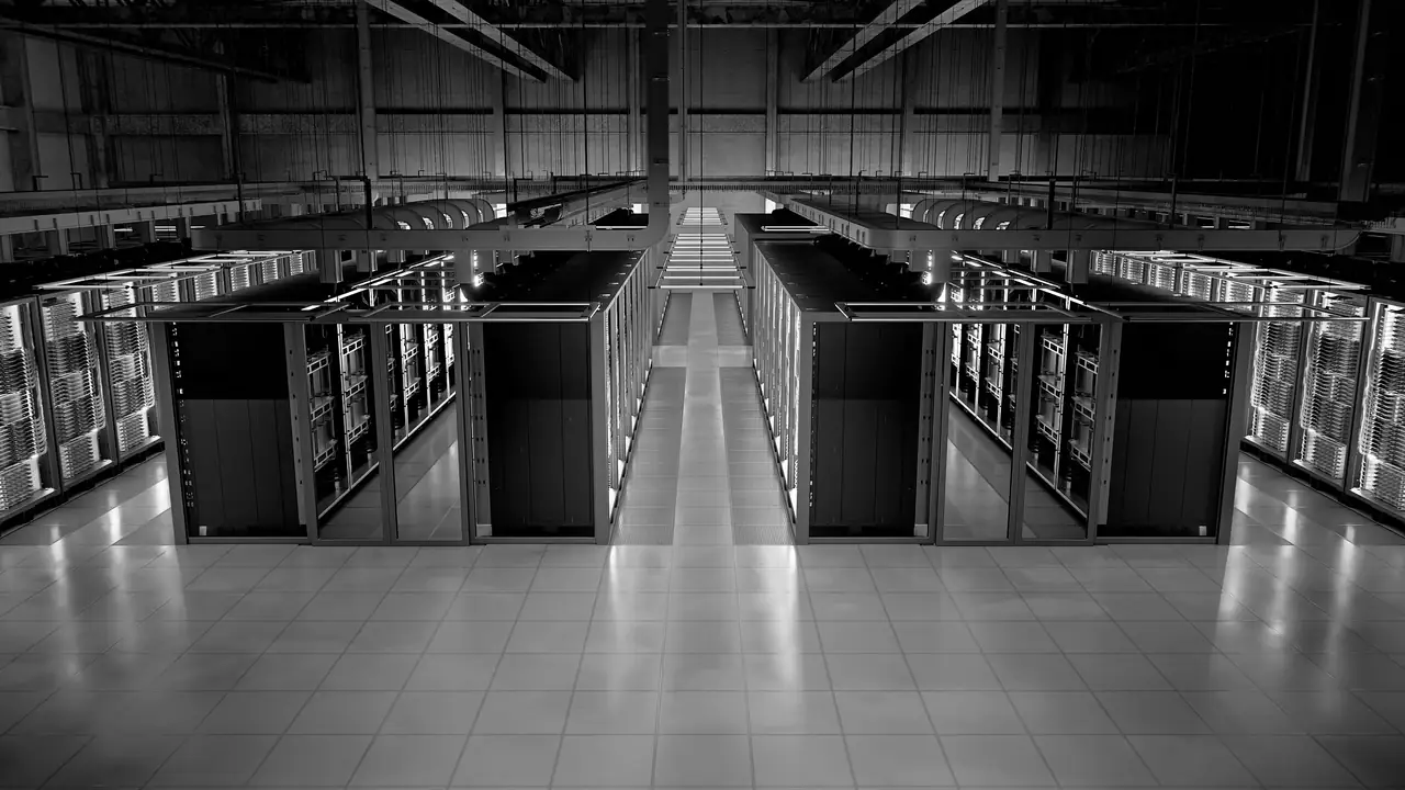 Rendered overhead view of a data-centre hall with rows of server racks either side of a central aisle